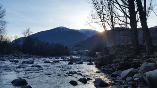 Scenic view of landscape against sky during winter