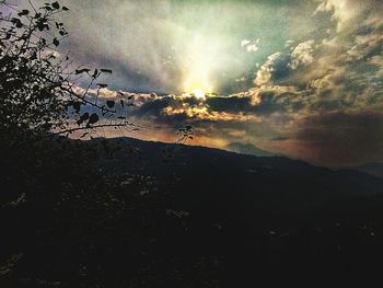 Scenic view of silhouette mountain against sky at sunset