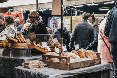 Rear view of people at market stall