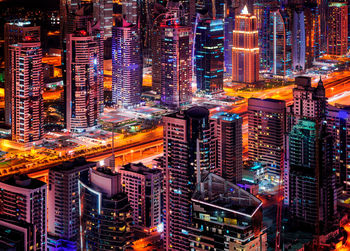 High angle view of illuminated cityscape at night