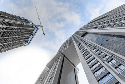 Low angle view of modern buildings against sky