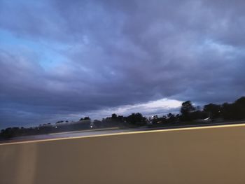 Scenic view of field against sky at dusk