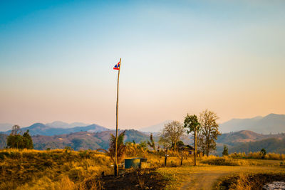 Scenic view of field against sky during sunset