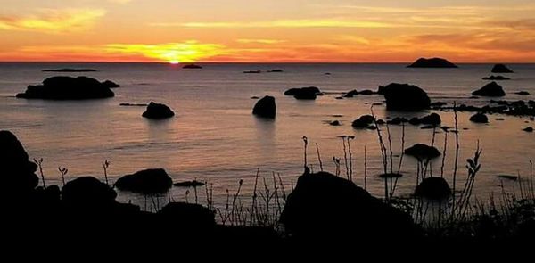 Scenic view of sea at sunset