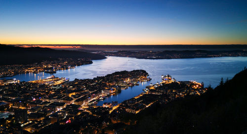 View of illuminated cityscape at dusk