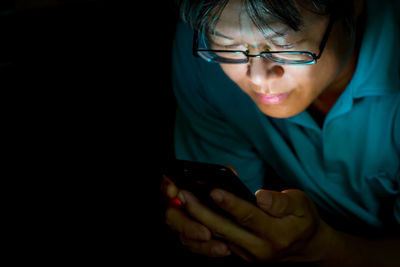 Close-up of woman using mobile phone