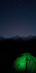 Low angle view of mountain against sky at night