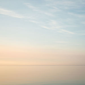Scenic view of sea against sky at sunset