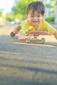 Portrait of cute boy playing outdoors