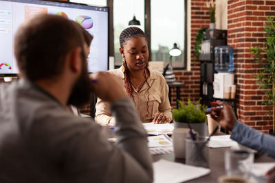 Business colleagues discussing in office