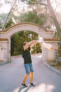 Full length of woman holding umbrella