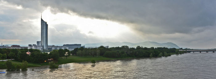 View of city against cloudy sky