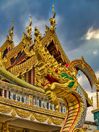 Low angle view of statue against temple building