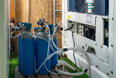 Gas cylinders connected to equipment in a backyard