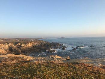 Scenic view of sea against clear sky