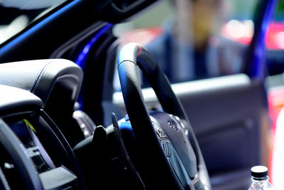 Close-up of steering wheel in car