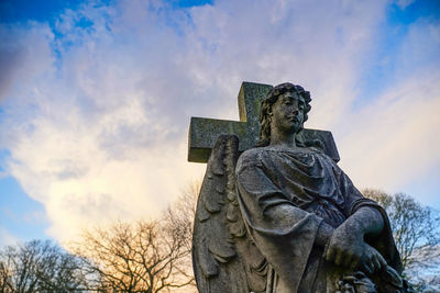Low angle view of statue against sky