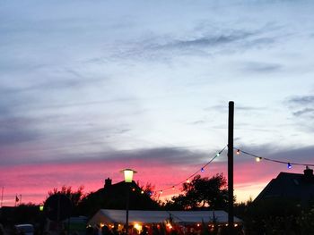 Silhouette trees against sky at sunset