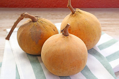 Heap of fresh ripe santol fruits also called wild mangosteen on kitchen towel