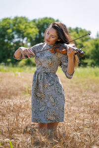 Woman standing on field