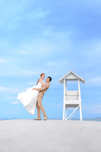 Bride and bridegroom at beach