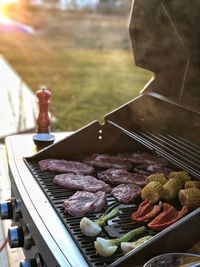 High angle view of meat on barbecue grill