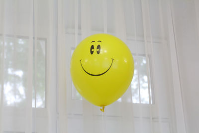 Balloon by window at home