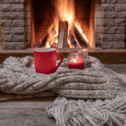 View of burning candles on wooden wall