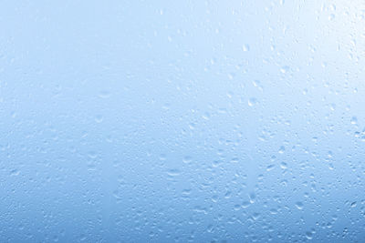 Full frame shot of raindrops on glass