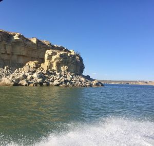 Scenic view of sea against clear blue sky