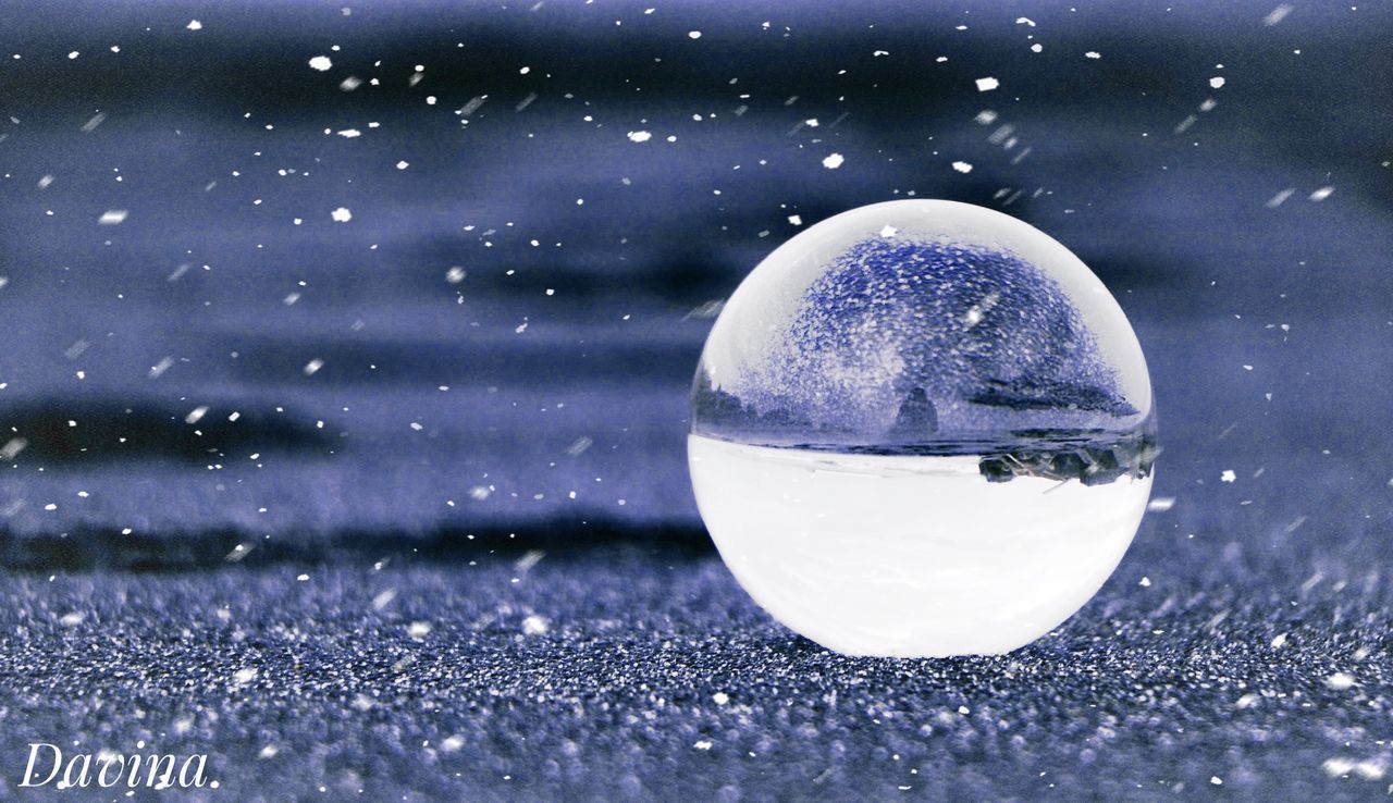 sphere, nature, no people, close-up, transparent, selective focus, snow, glass - material, winter, cold temperature, crystal, vulnerability, day, fragility, shape, outdoors, crystal ball, reflection, focus on foreground, snowing, purple, purity