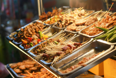 Grilled dishes like pork, okra, beef, bell pepper in ho thi ky street food, ho chi minh city