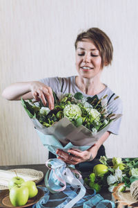 Happy young woman eating food