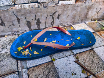 High angle view of umbrella on rock against wall