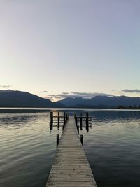 Pier over lake against sky