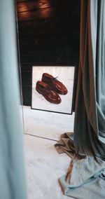 High angle view of shoes on window