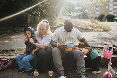 Family with daughters spending time actively outdoors