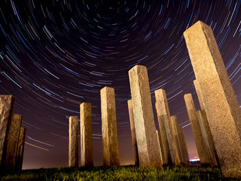 Low angle view of built structure against sky at night