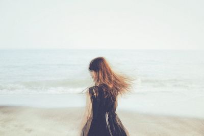 Woman standing on beach