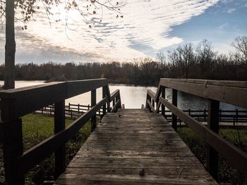 Pier over lake against sky