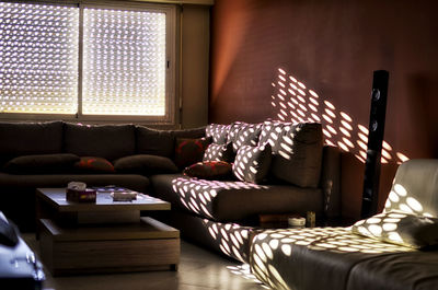 Woman relaxing on sofa at home