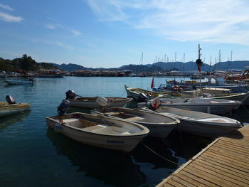 Boats moored at harbor