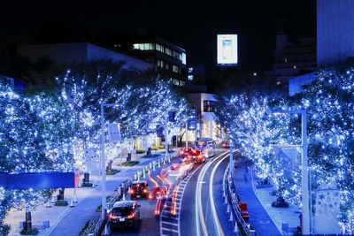 Light trails on road in city at night