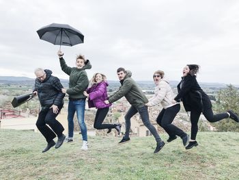 People on friends against sky