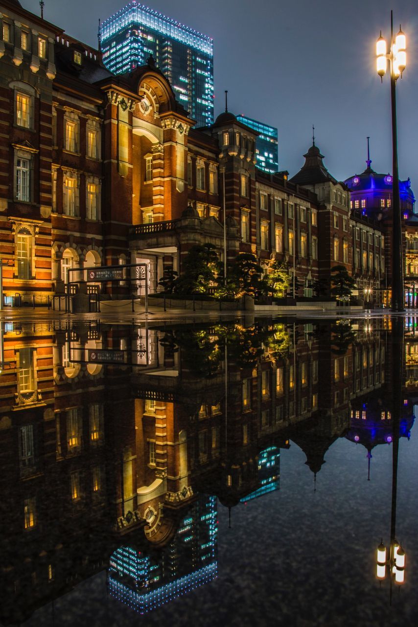 REFLECTION OF ILLUMINATED BUILDINGS IN RIVER