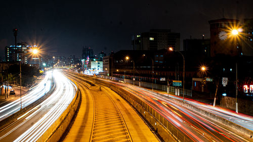 Light trails on city street at night