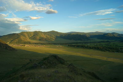 View of landscape against cloudy sky