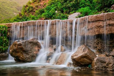 View of waterfall in forest