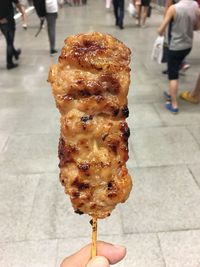 Close-up of hand holding ice cream