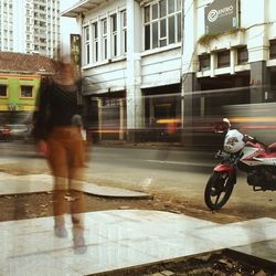 Woman standing in city